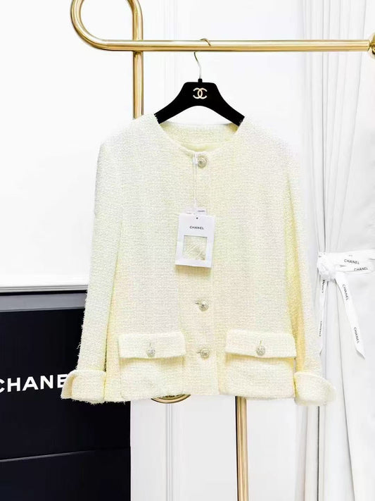 Chanel Spring/Summer 2023 Collection: Pale Yellow Diamond-Buckle Knitted Jacket