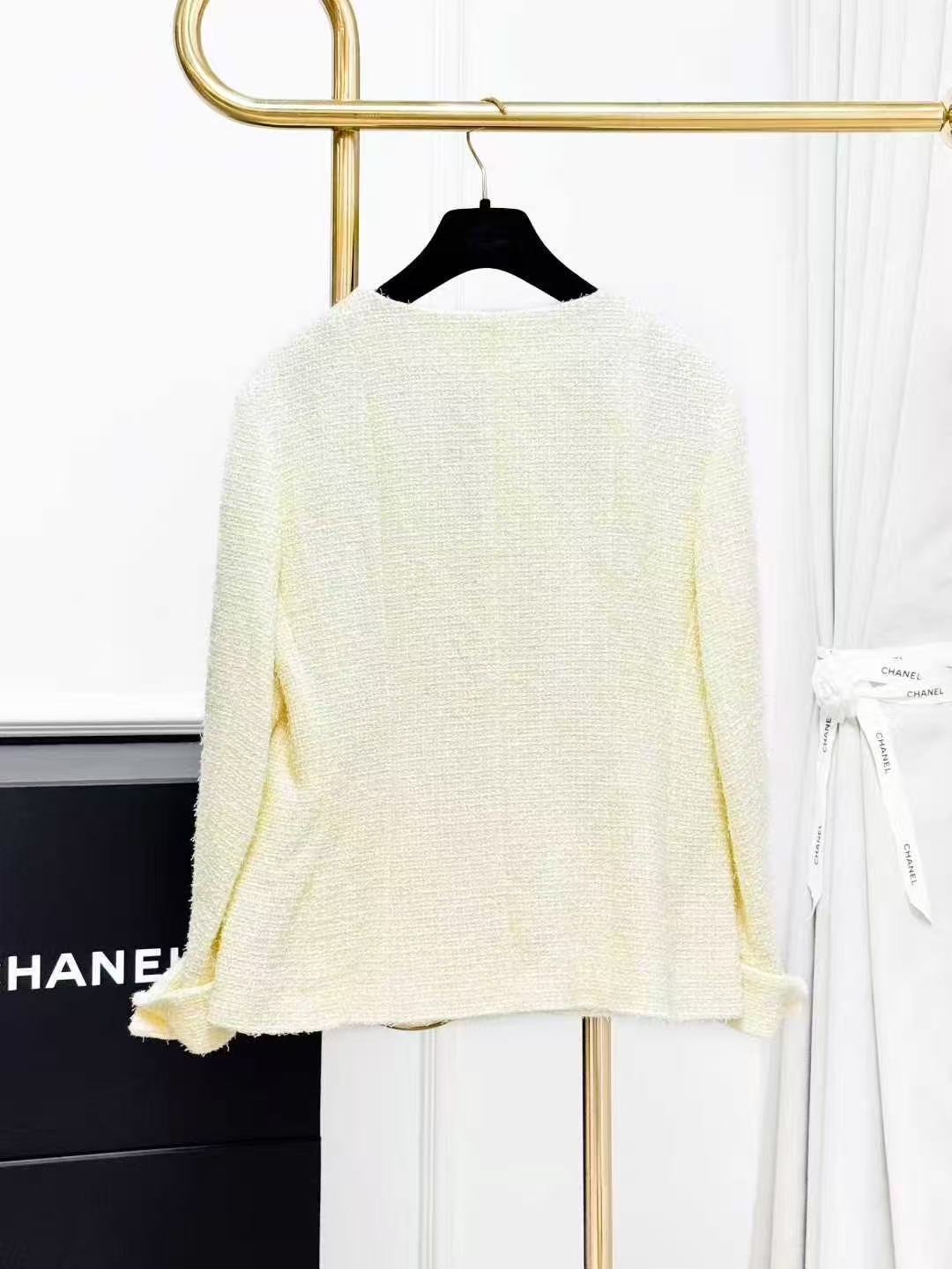 Chanel Spring/Summer 2023 Collection: Pale Yellow Diamond-Buckle Knitted Jacket