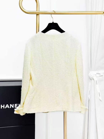 Chanel Spring/Summer 2023 Collection: Pale Yellow Diamond-Buckle Knitted Jacket