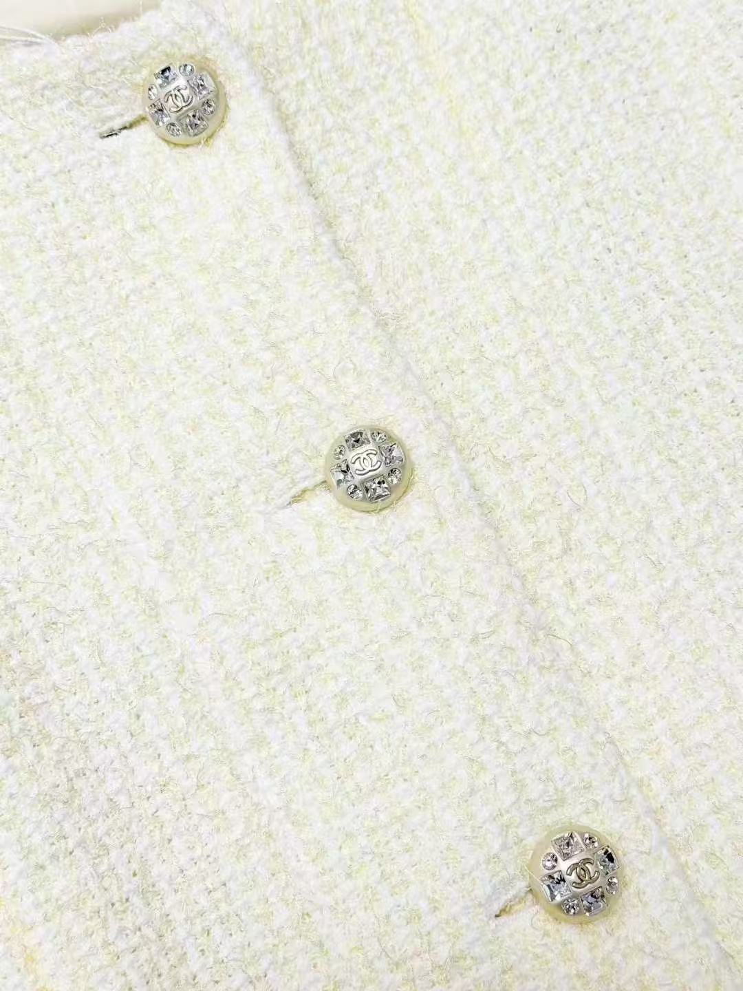 Chanel Spring/Summer 2023 Collection: Pale Yellow Diamond-Buckle Knitted Jacket
