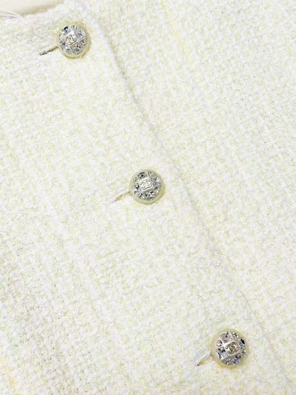 Chanel Spring/Summer 2023 Collection: Pale Yellow Diamond-Buckle Knitted Jacket