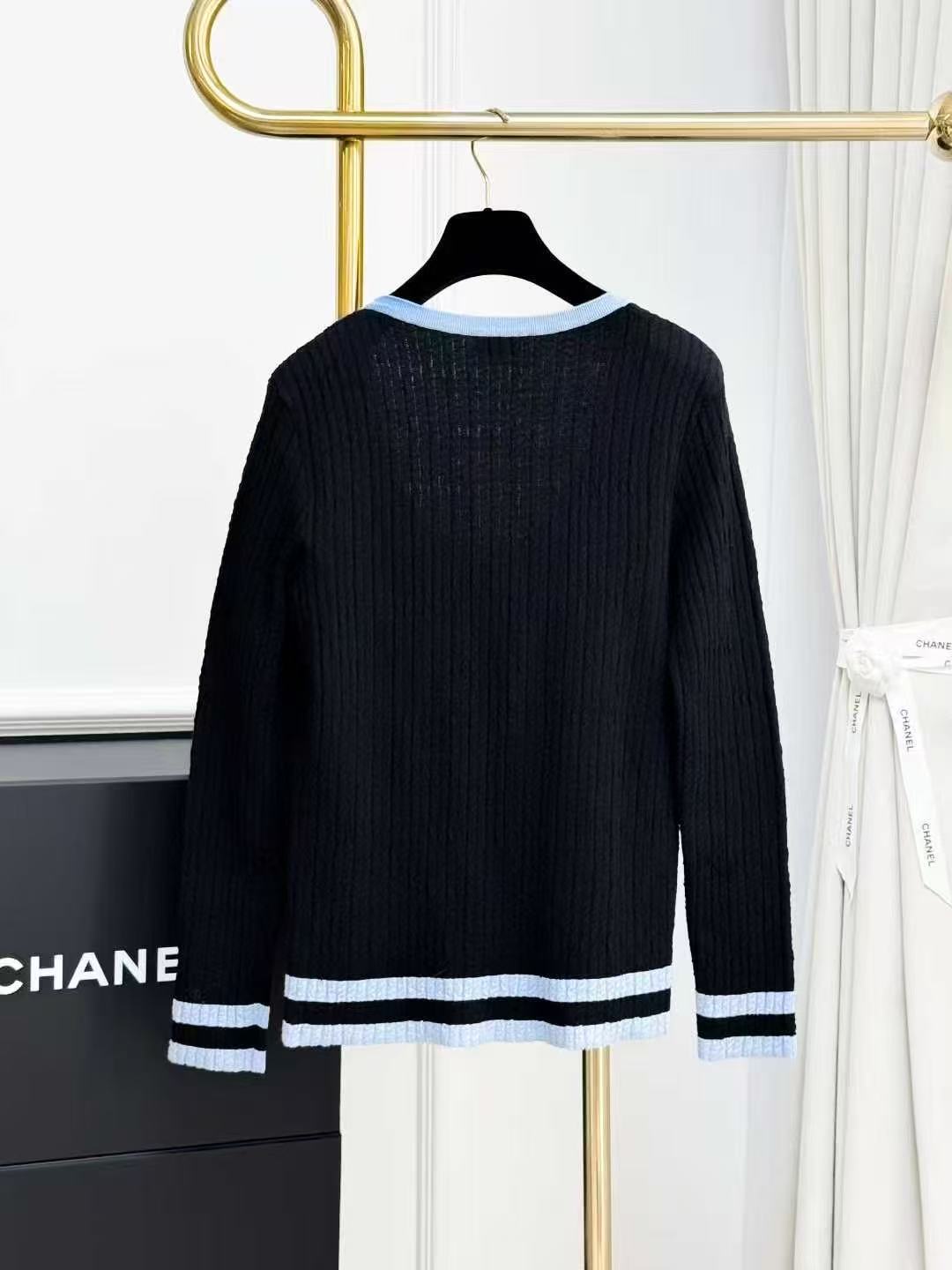 Chanel 24B Black Knitted Top with Blue Trim, Large Neckline and Long Sleeves